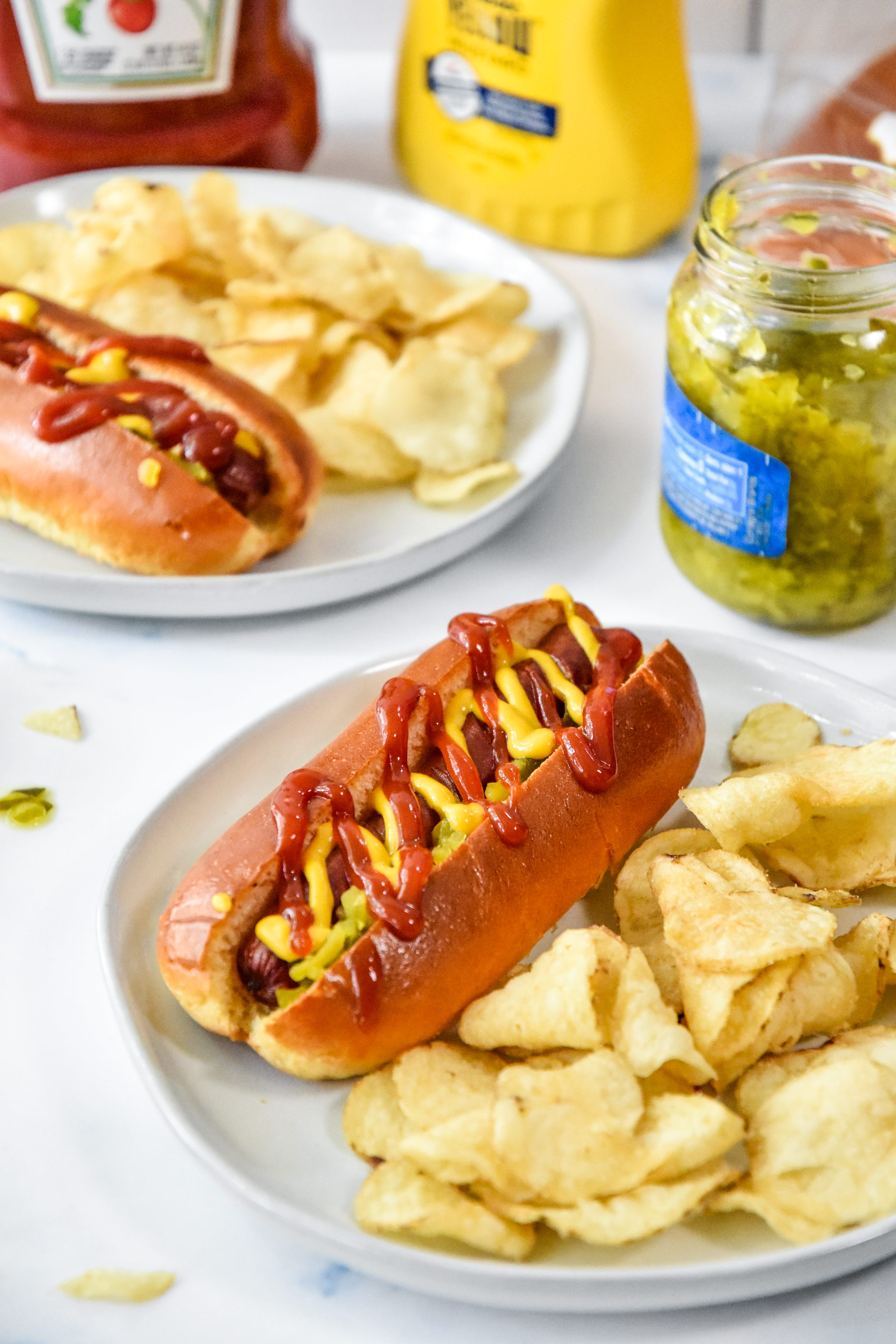 air fryer hot dogs served with chips.