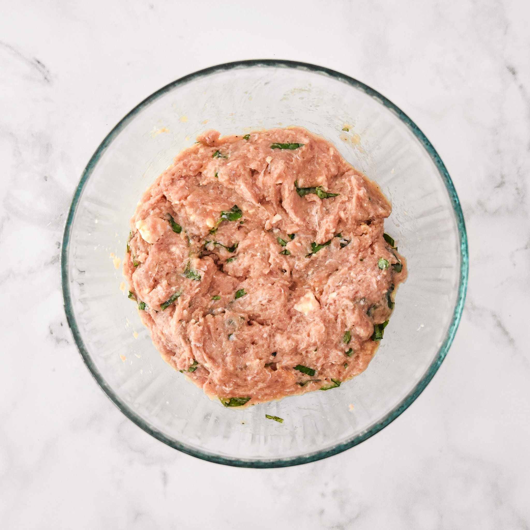 ingredients in a glass bowl all mixed together.