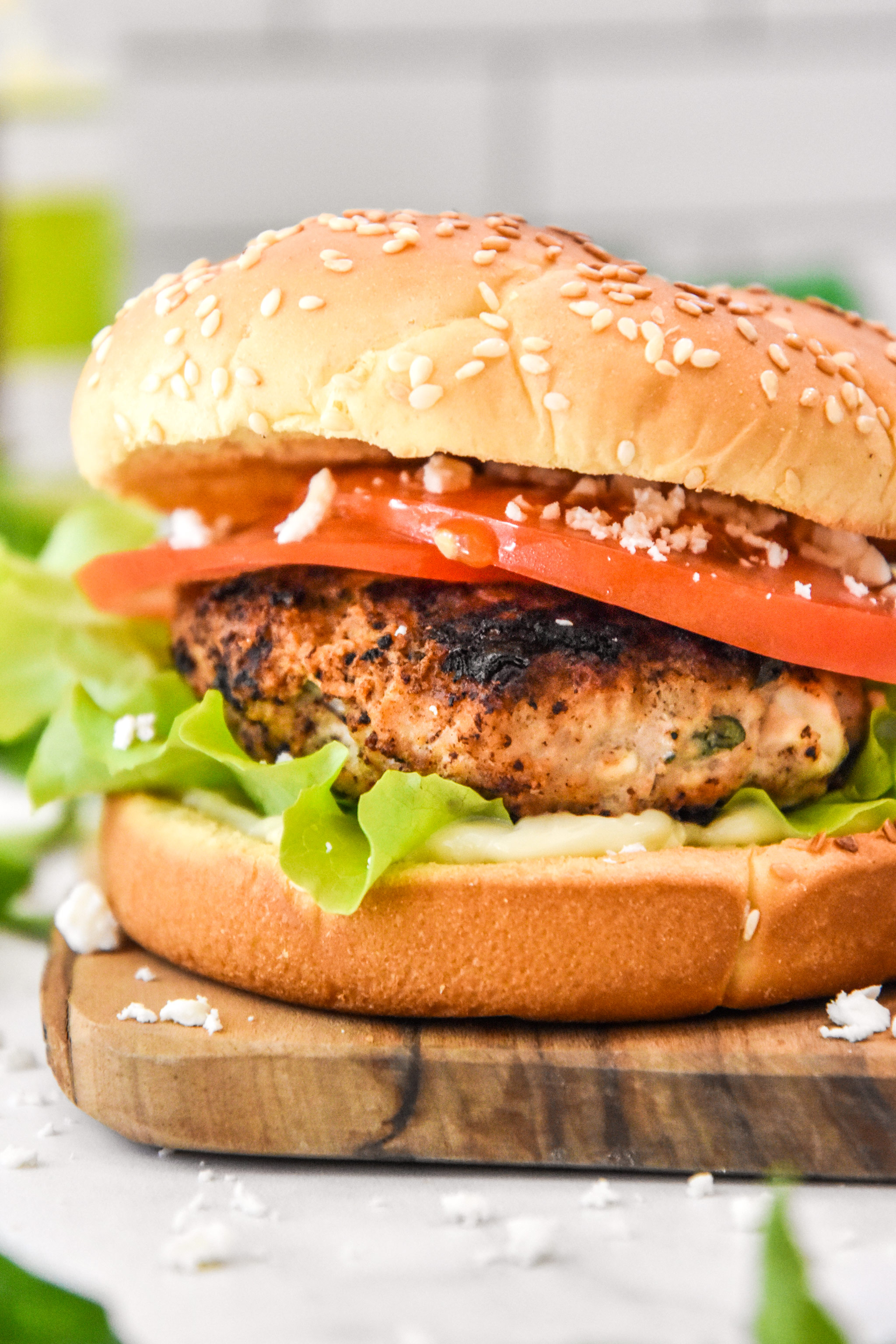 close up of assembled feta basil turkey burger on a bun.