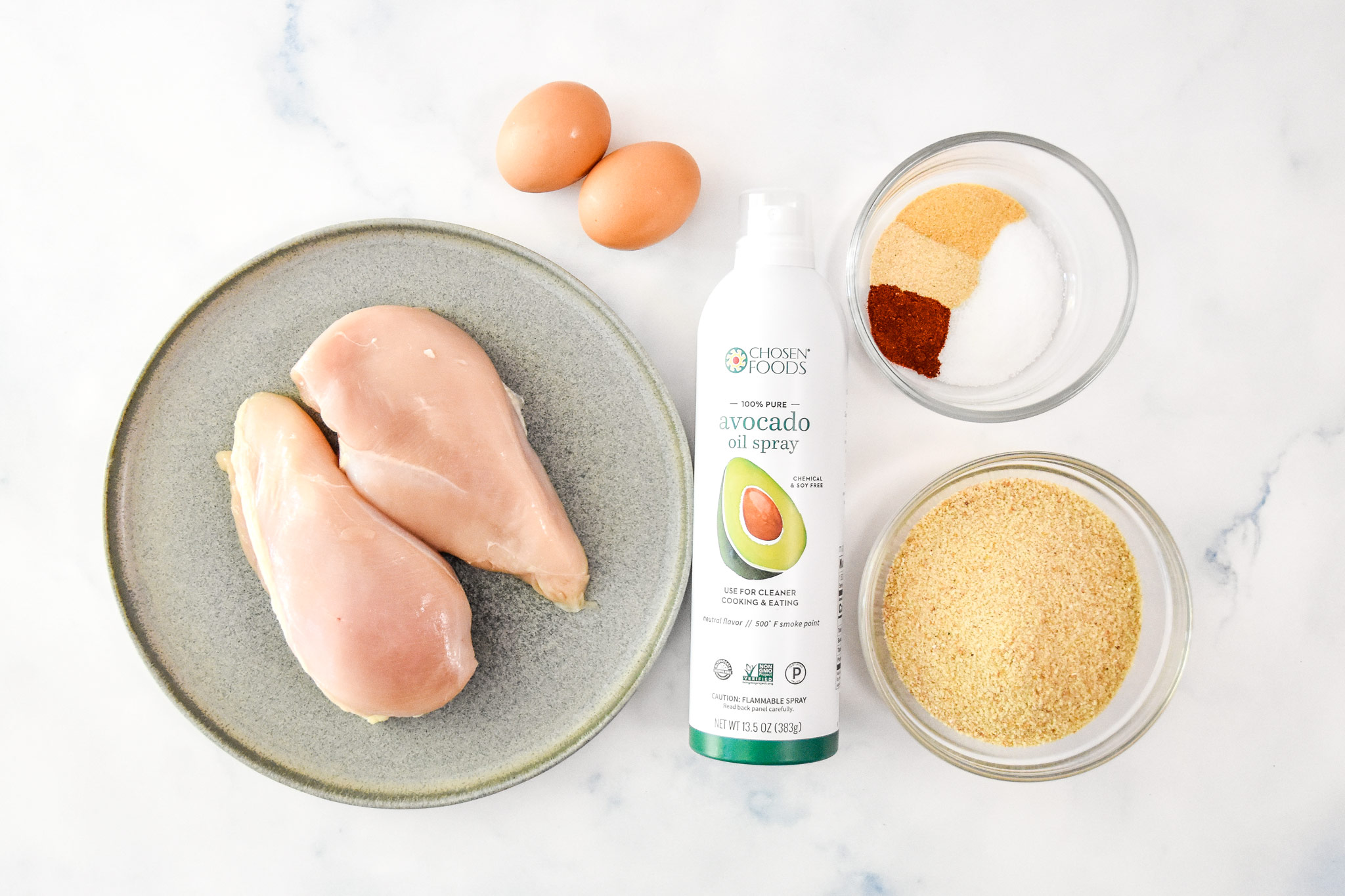 ingredients for the air fryer breaded chicken tenders including raw chicken.