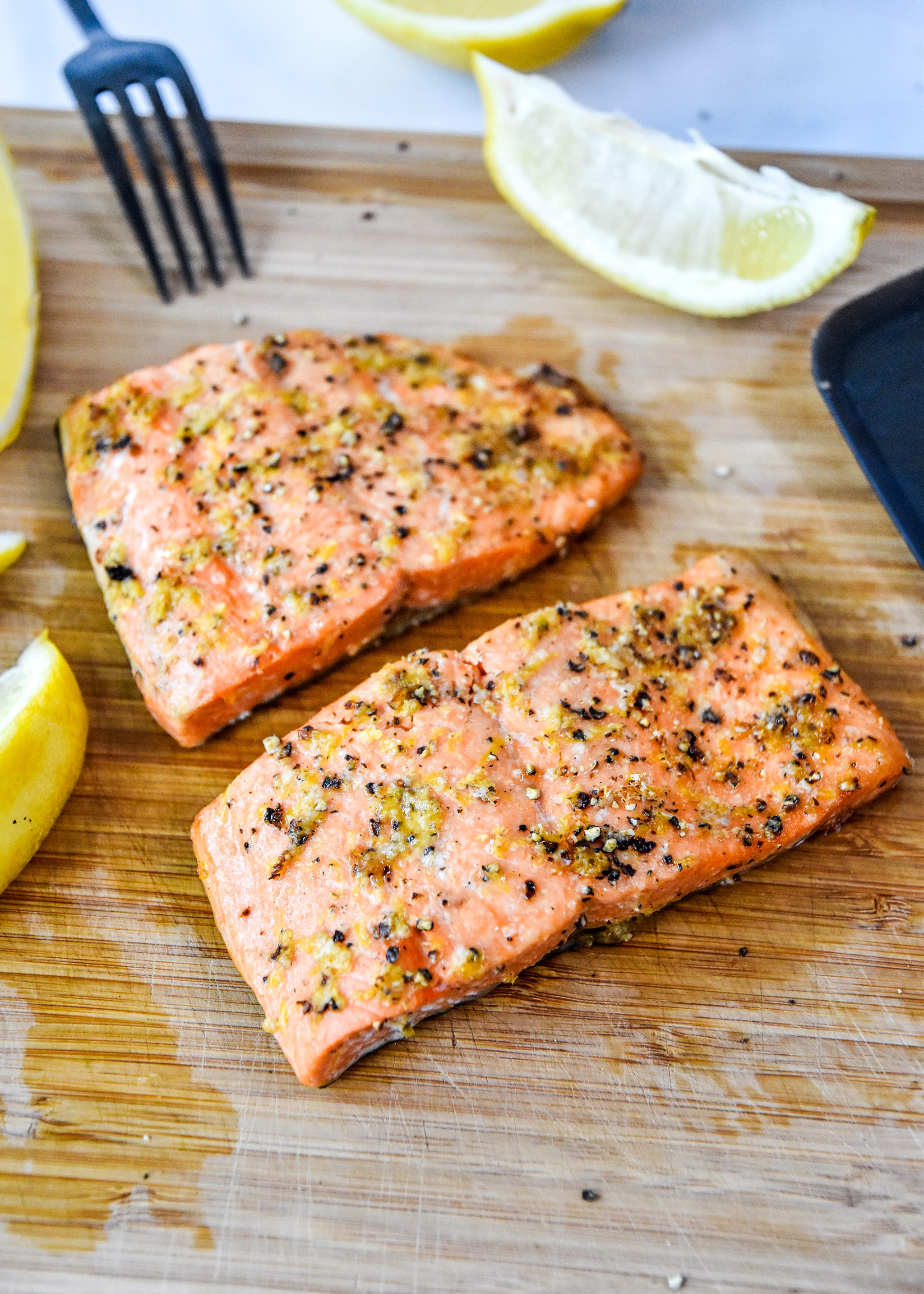 air fryer lemon pepper cooked on a cutting board.