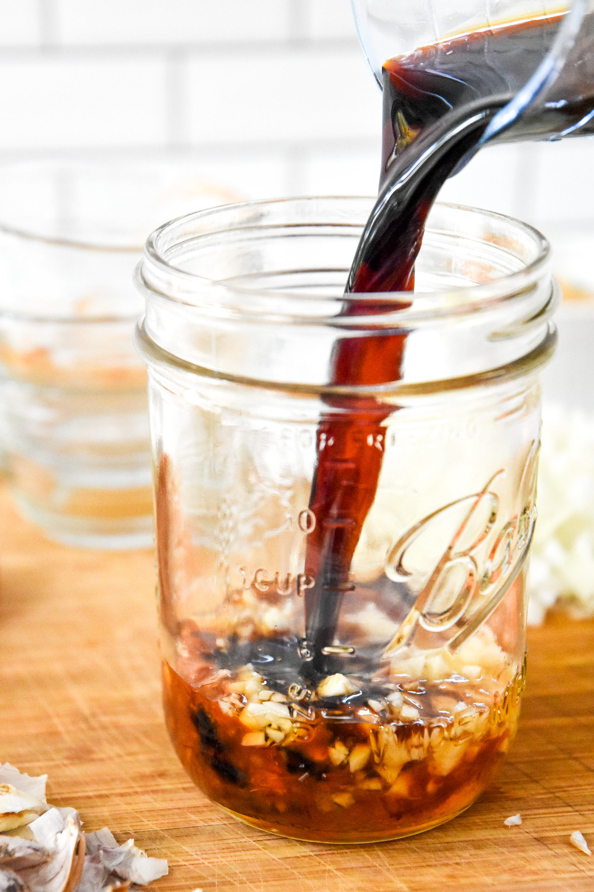 prepping the sauce in a mason jar for the easy cashew chicken meal prep.
