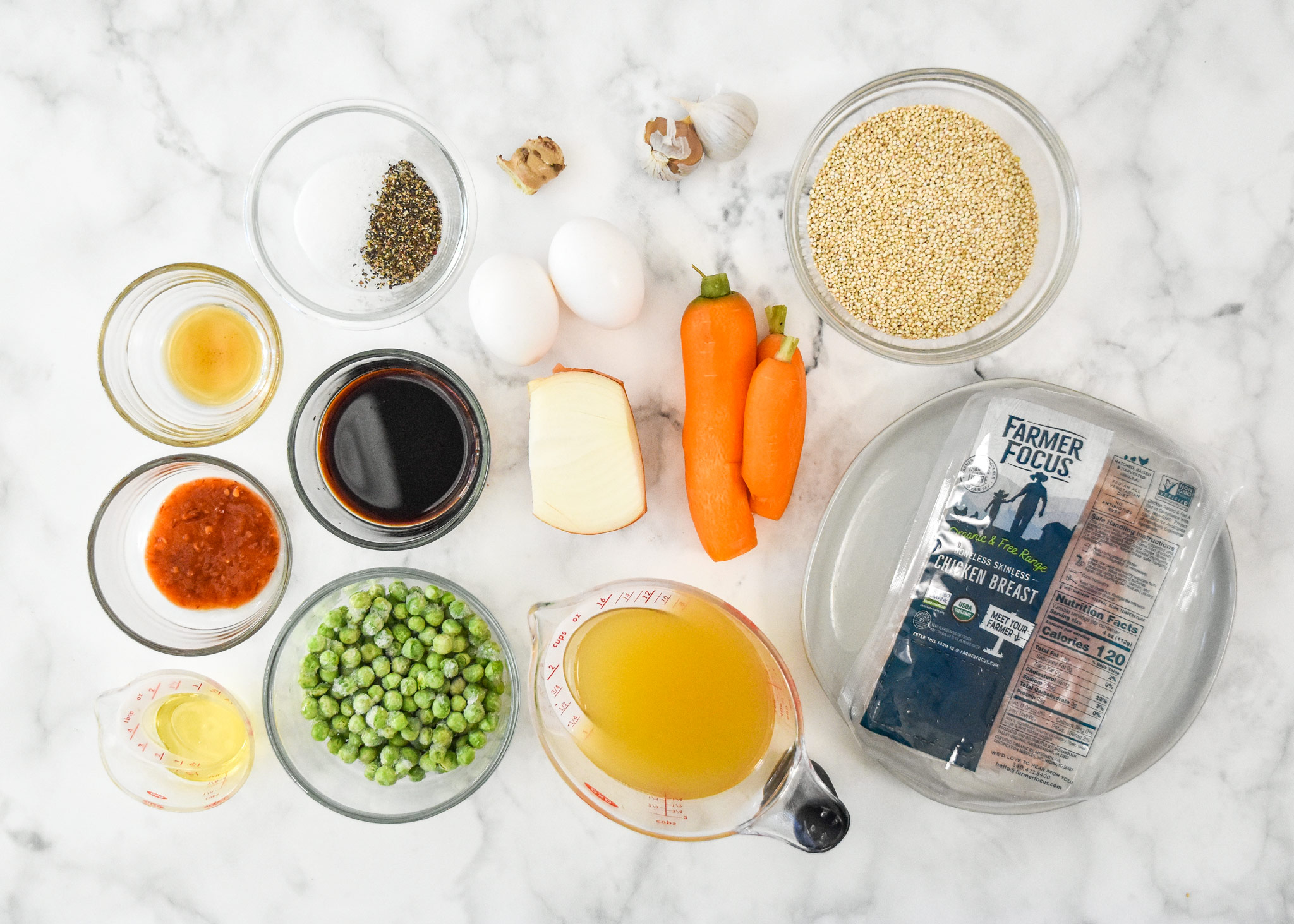 ingredients in the meal prep chicken quinoa fried rice bowls before cooking.