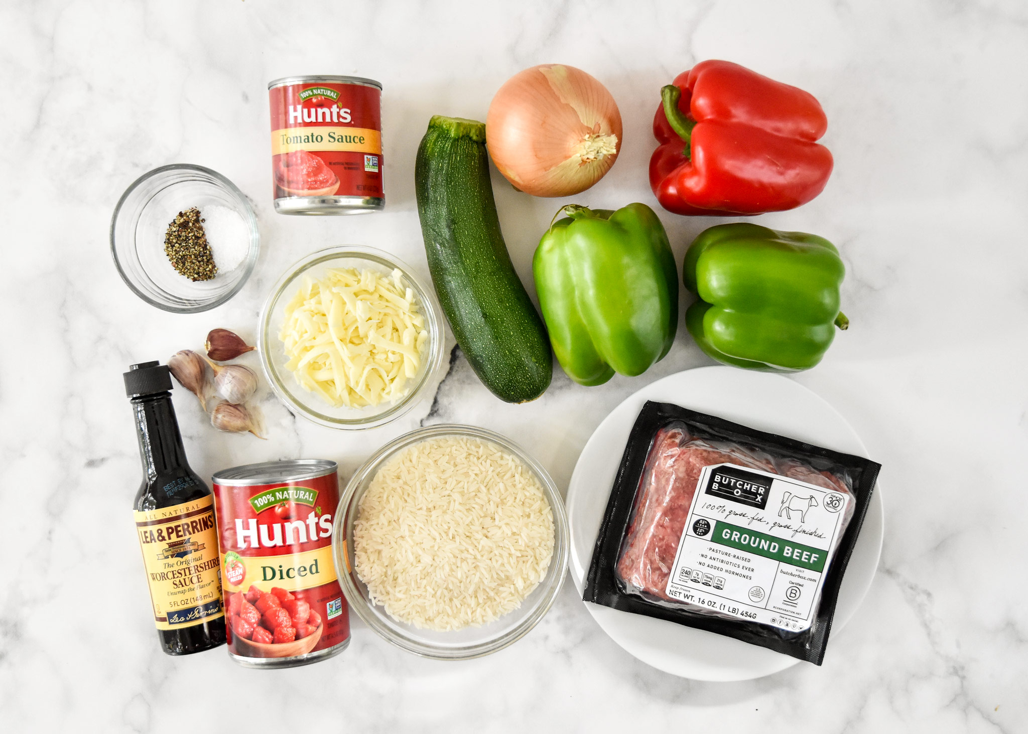 ingredients laid out for the unstuffed pepper bowls including red and green bell peppers.