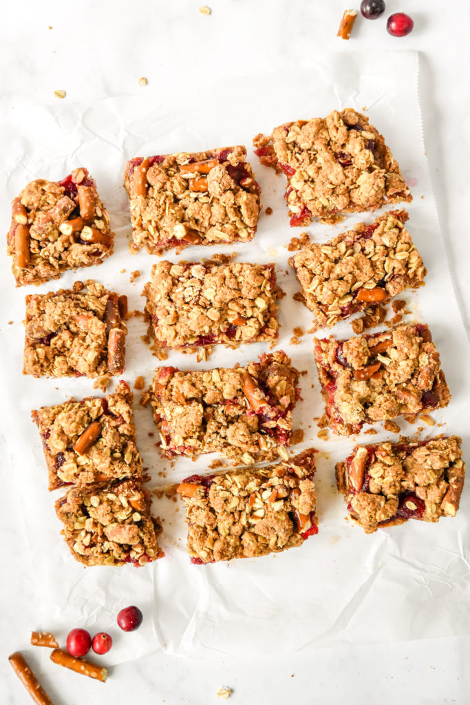 photo of cooked cranberry pretzel oat crumble bars cut into 12 bars.