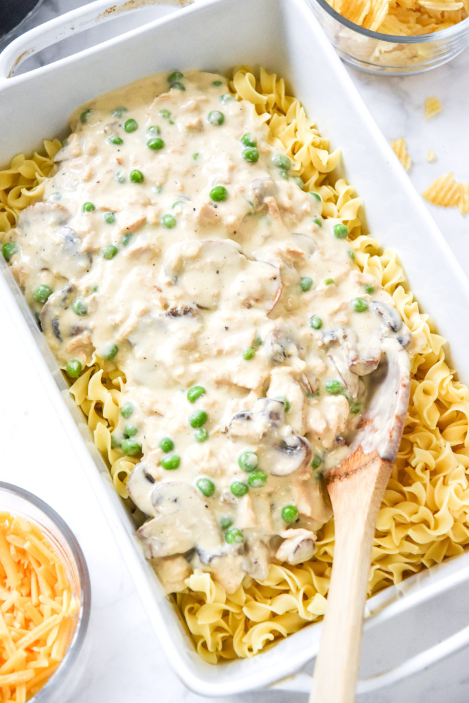 sauce poured over noodles in a casserole dish.