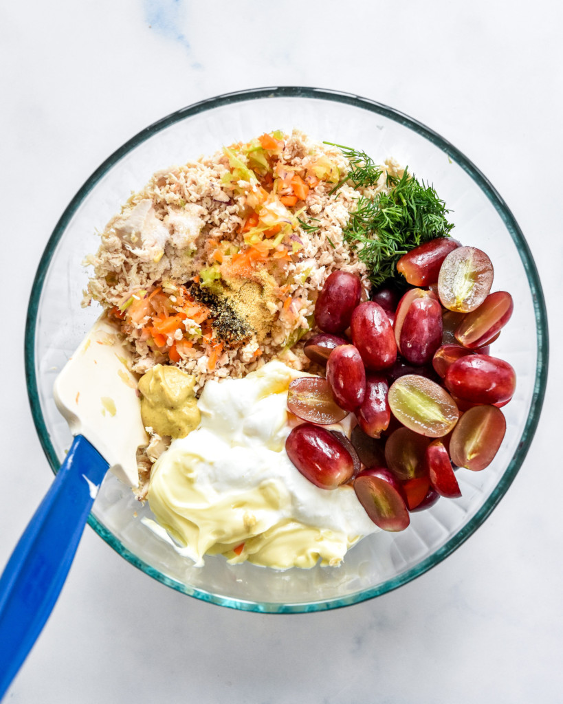 bowl of ingredients before mixing the easy chicken salad with grapes.
