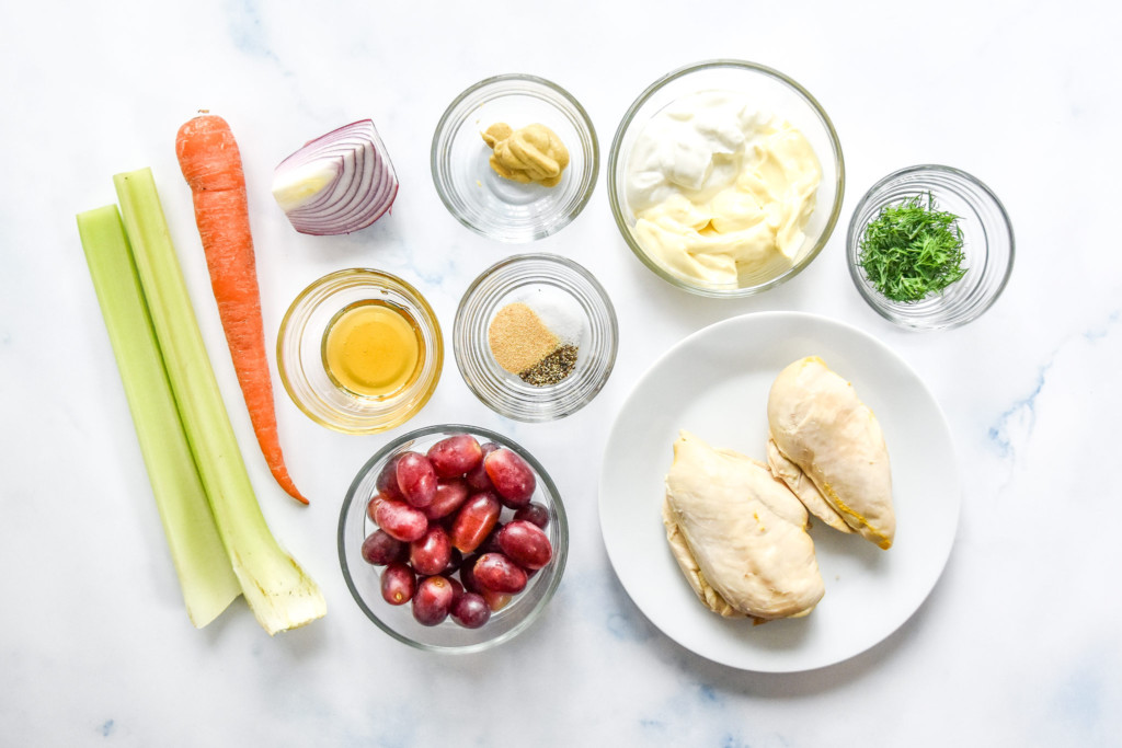 ingredients for the easy chicken salad with grapes on a flat surface.