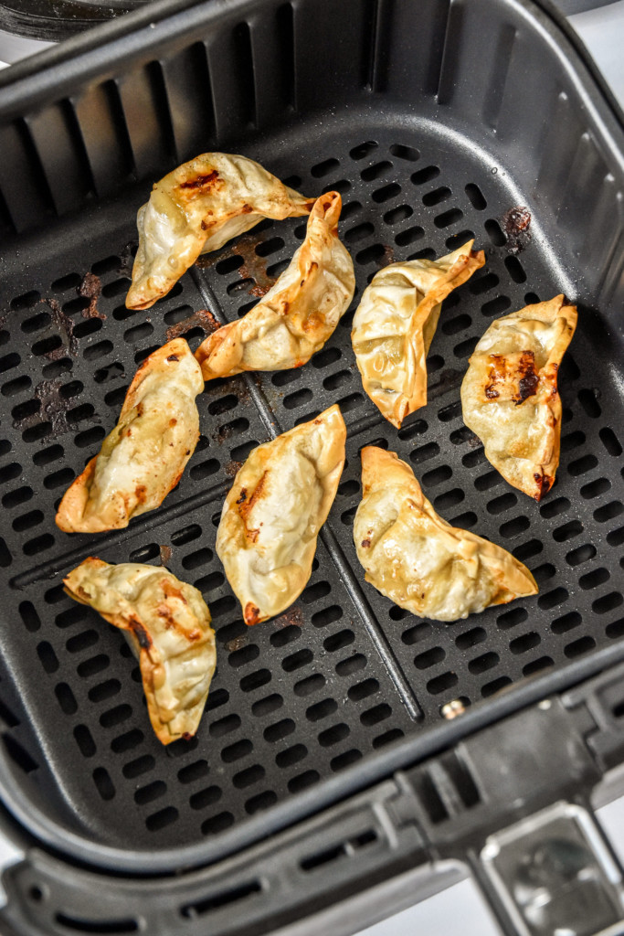 cooked frozen potstickers in an air fryer.