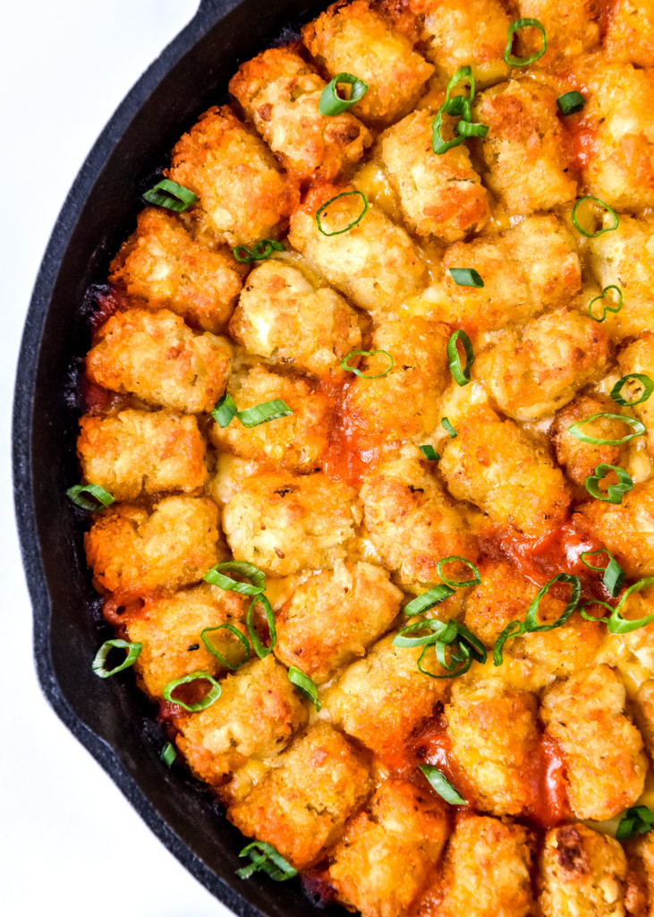 close up of the top of a cooked turkey sloppy joe tater tot casserole.
