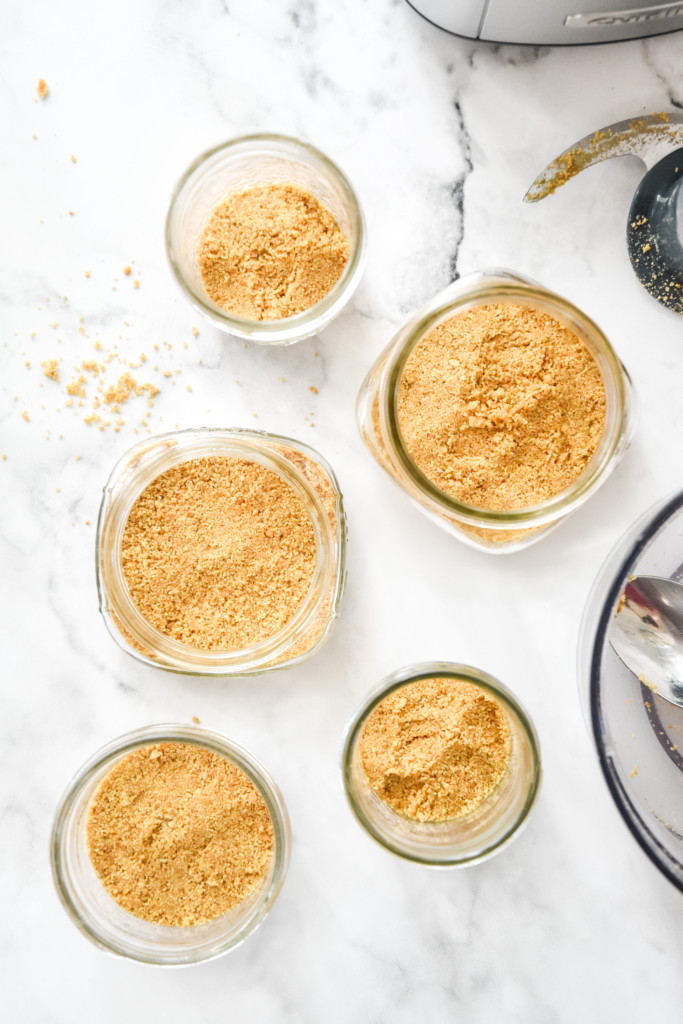 graham cracker crust pressed into the bottom of mason jars for the no-bake cheesecake greek yogurt jars.