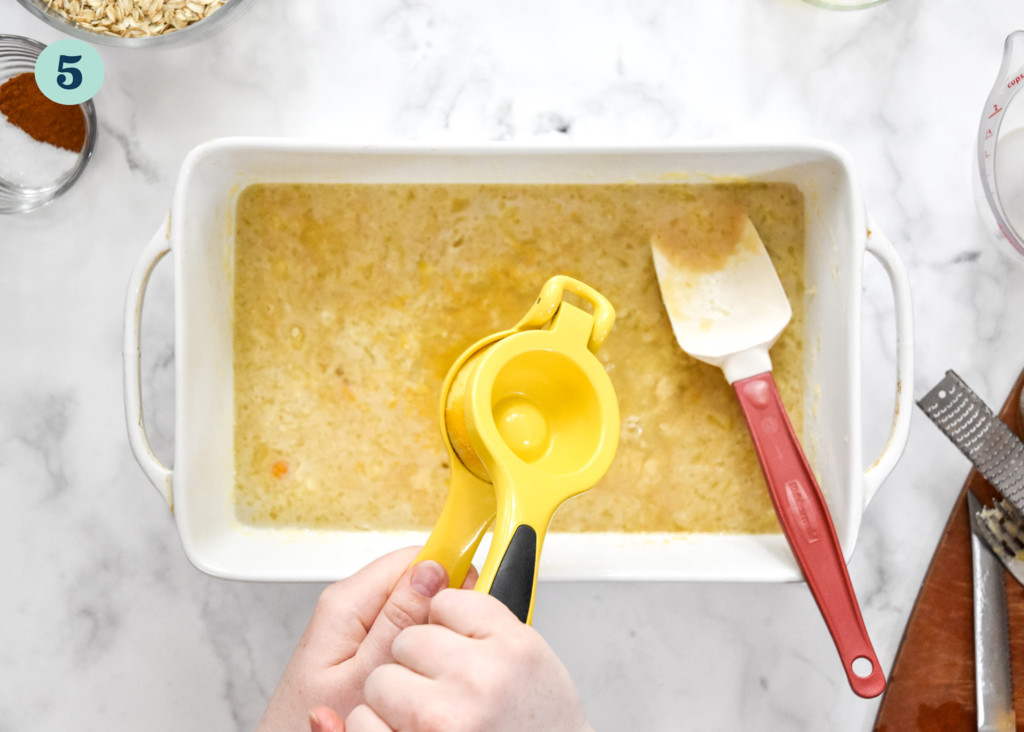 step 5 adding lemon juice to the easy blueberry lemon baked oatmeal.