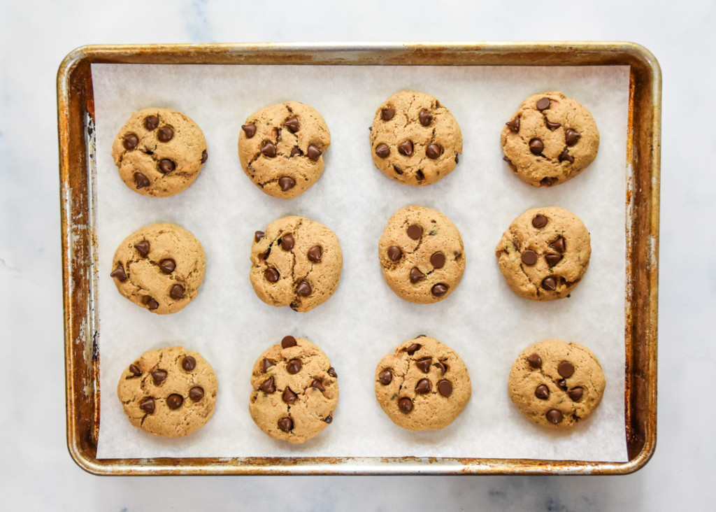 baked chocolate chip pancake mix cookies on a sheet pan.
