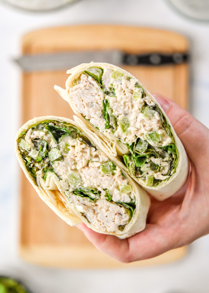 holding the caesar chicken salad lunch wrap in hand.