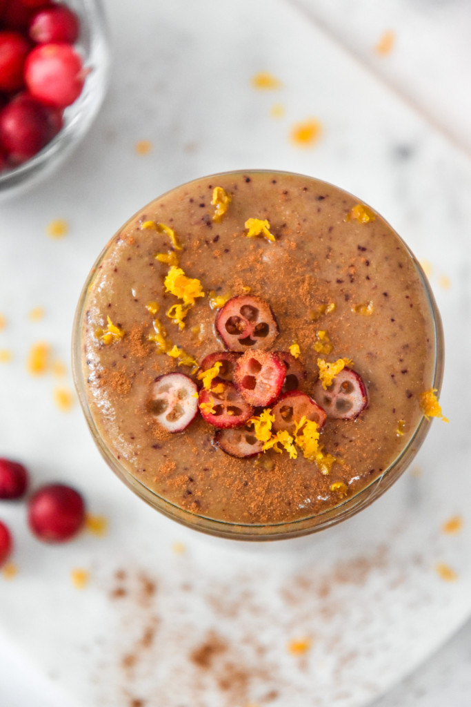 Cranberry Orange cinnamon holiday smoothie in a glass mason jar.