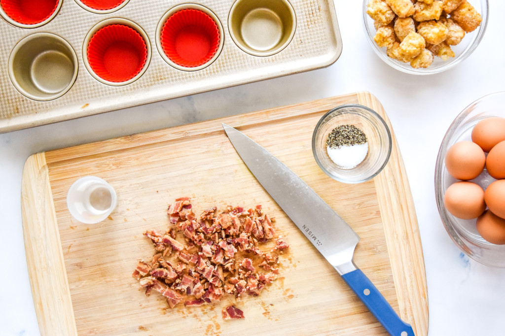 chopping bacon for the tater tot crust baked egg cups.