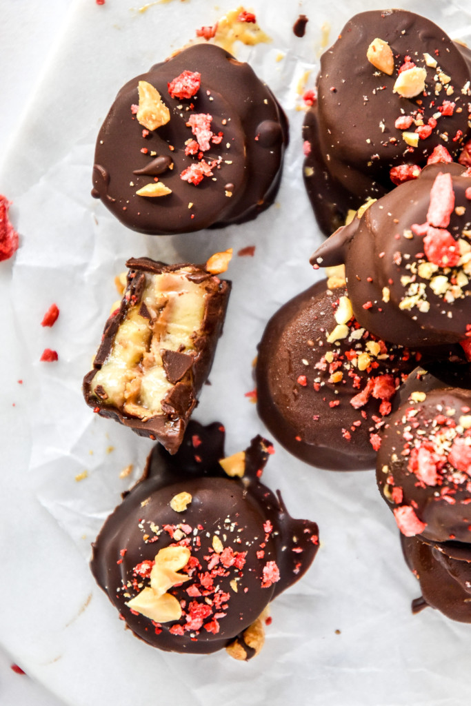 chocolate covered PB&J banana bites on parchment paper.