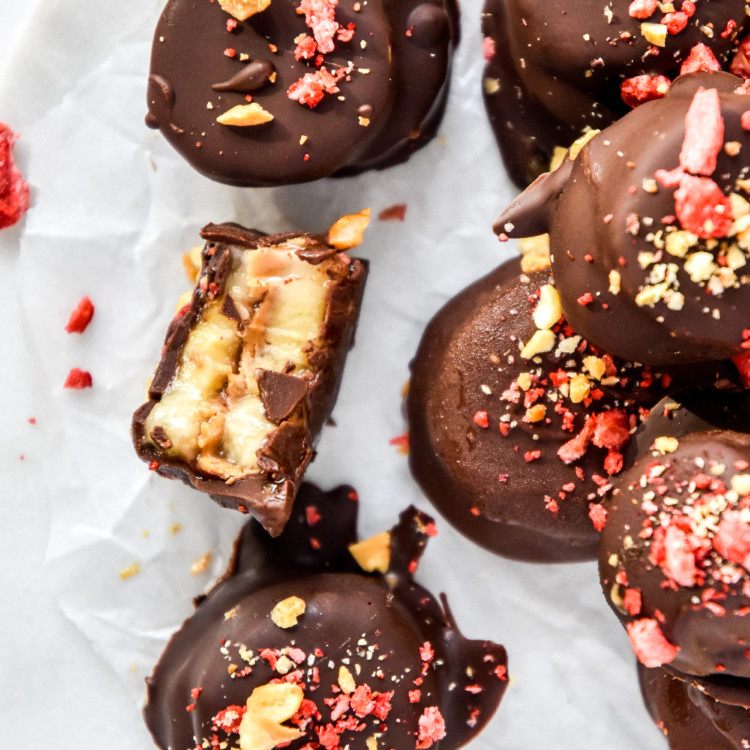 chocolate covered PB&J banana bites on parchment paper.