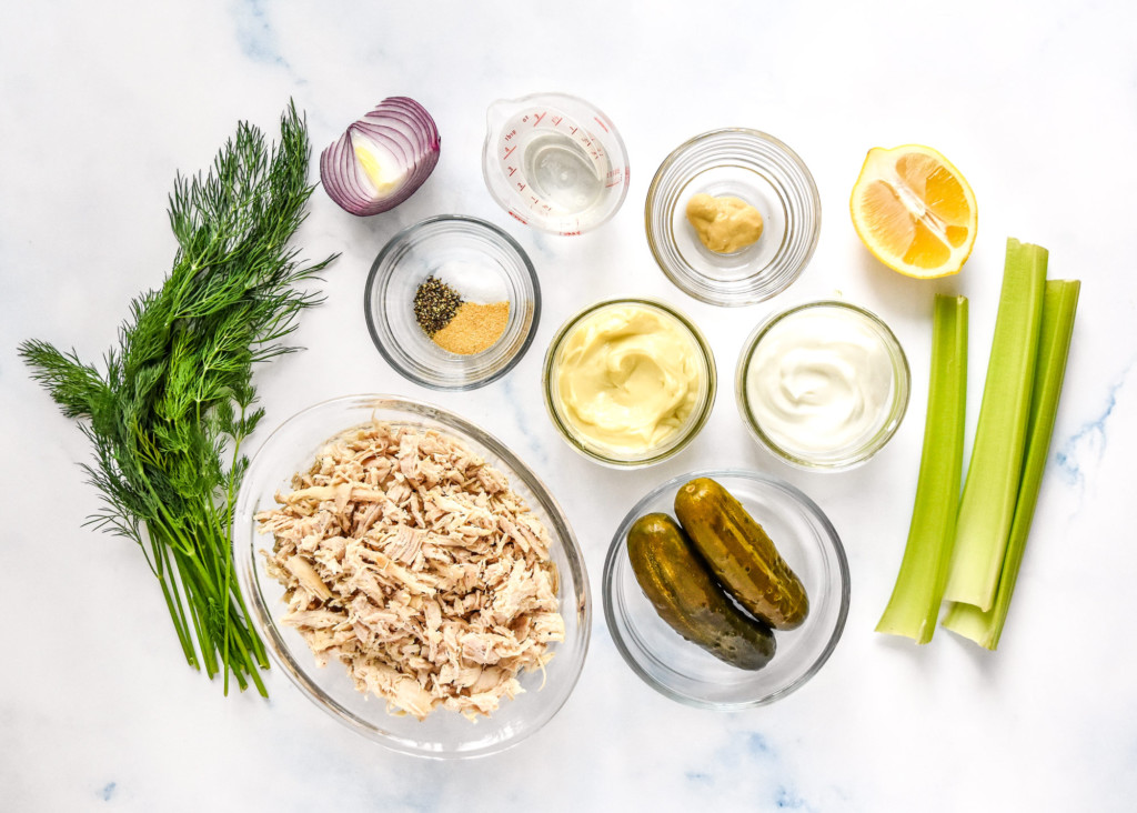 ingredients on a counter before preparing the dill pickle chicken salad.