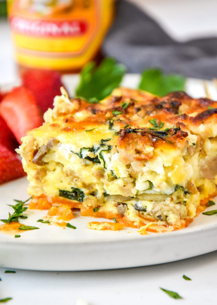 a piece of breakfast casserole on a plate.