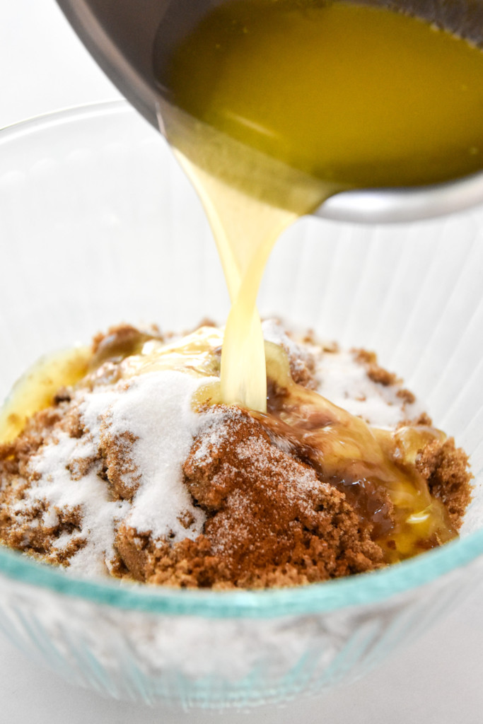 pouring butter into a bowl for the crumb topping.