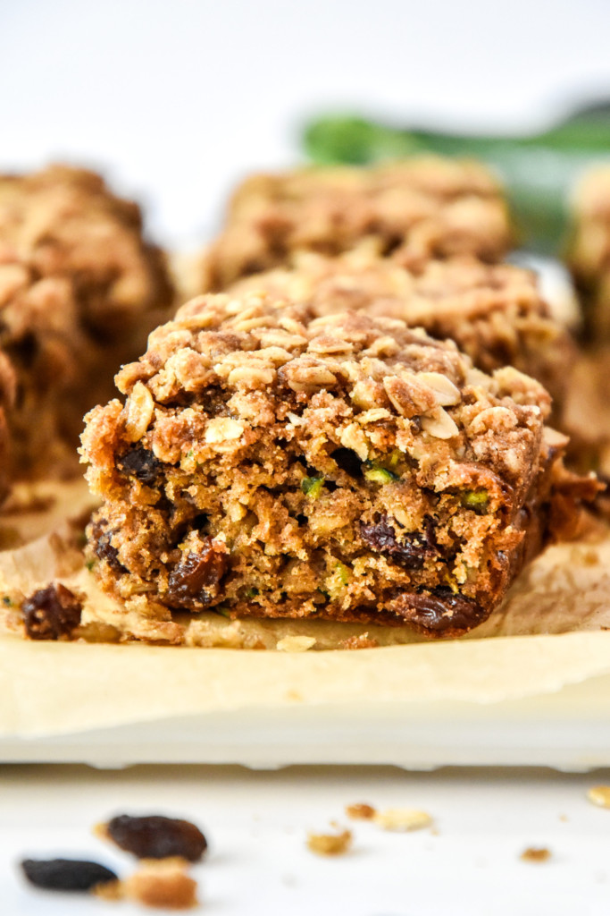 side view of a cut piece of cinnamon raisin zucchini coffee cake.