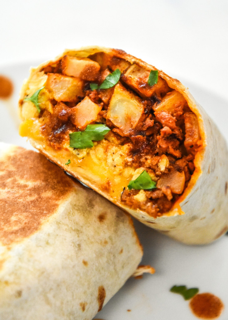 meal prep soy chorizo breakfast burritos cut in half and zoomed in on inside fillings.