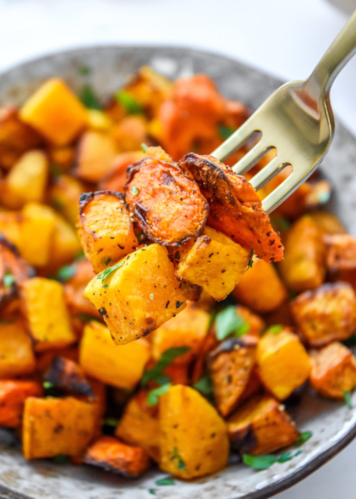 a fork bite with a few pieces of air fryer roasted fall vegetables.