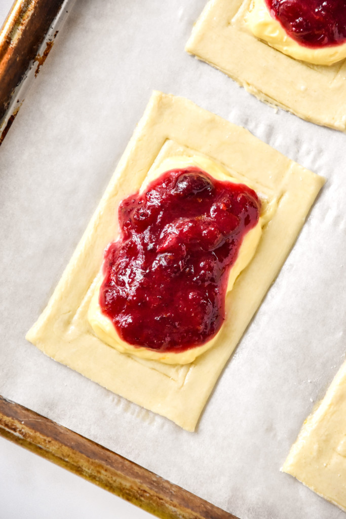 a close up of the raw pastry with toppings before baking.