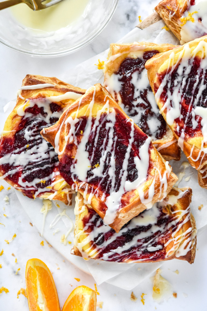 leftover cranberry sauce cheese danish with icing drizzled on top.