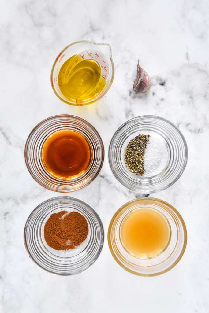 dressing ingredients in glass dishes for the maple vinaigrette.