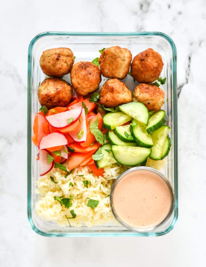 banh mi inspired meal prep bowls in a rectangular glass meal prep container.