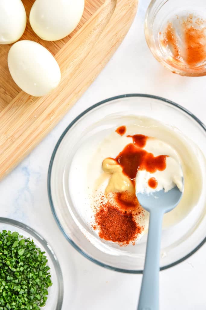 mixing the sauce based for the easy deviled egg salad.