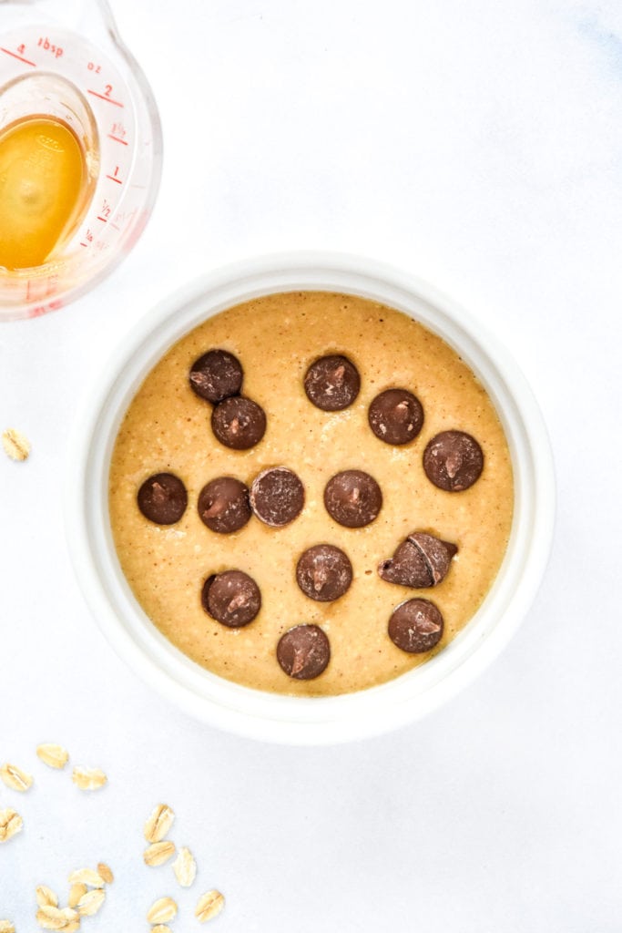 raw individual air fryer baked oats with chocolate chips on top before baking.