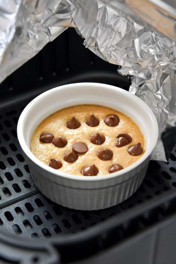 half way cooked individual air fryer baked oats in a white ramekin.