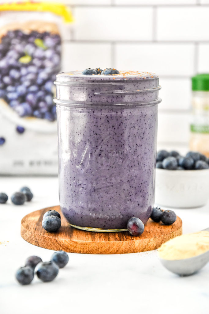 peanut butter powder blueberry cinnamon smoothie with fresh blueberries.