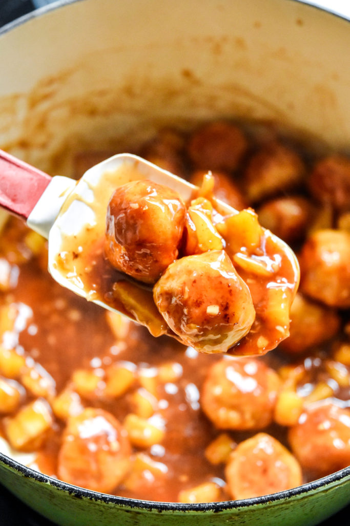 spoonful of homemade pineapple teriyaki chicken meatballs just cooked.