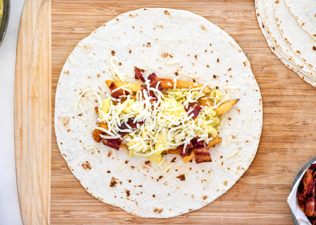 meal prep california style breakfast burrito before wrapping up.