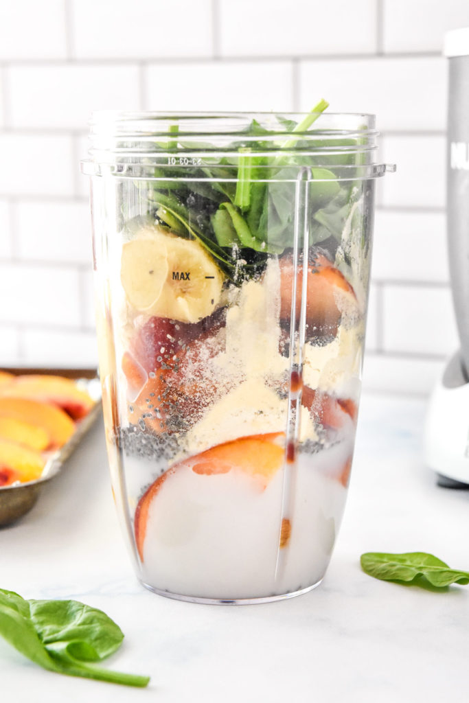 ingredients for the smoothie in the nutribullet blender before blending.