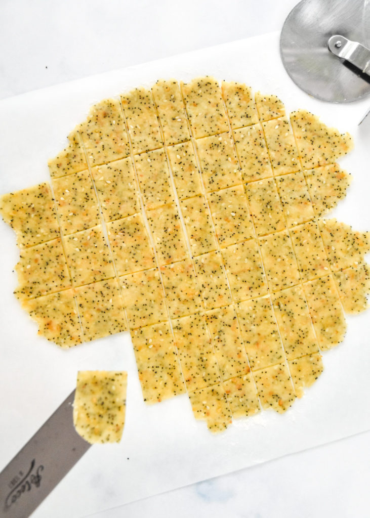 rolled cracker dough cut into pieces.