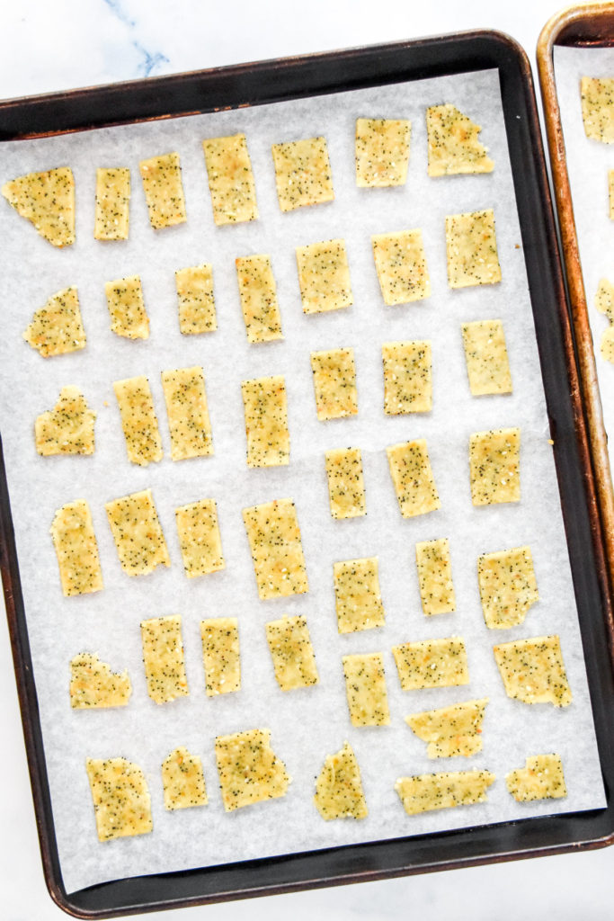 raw cracker dough on a sheet pan before baking.