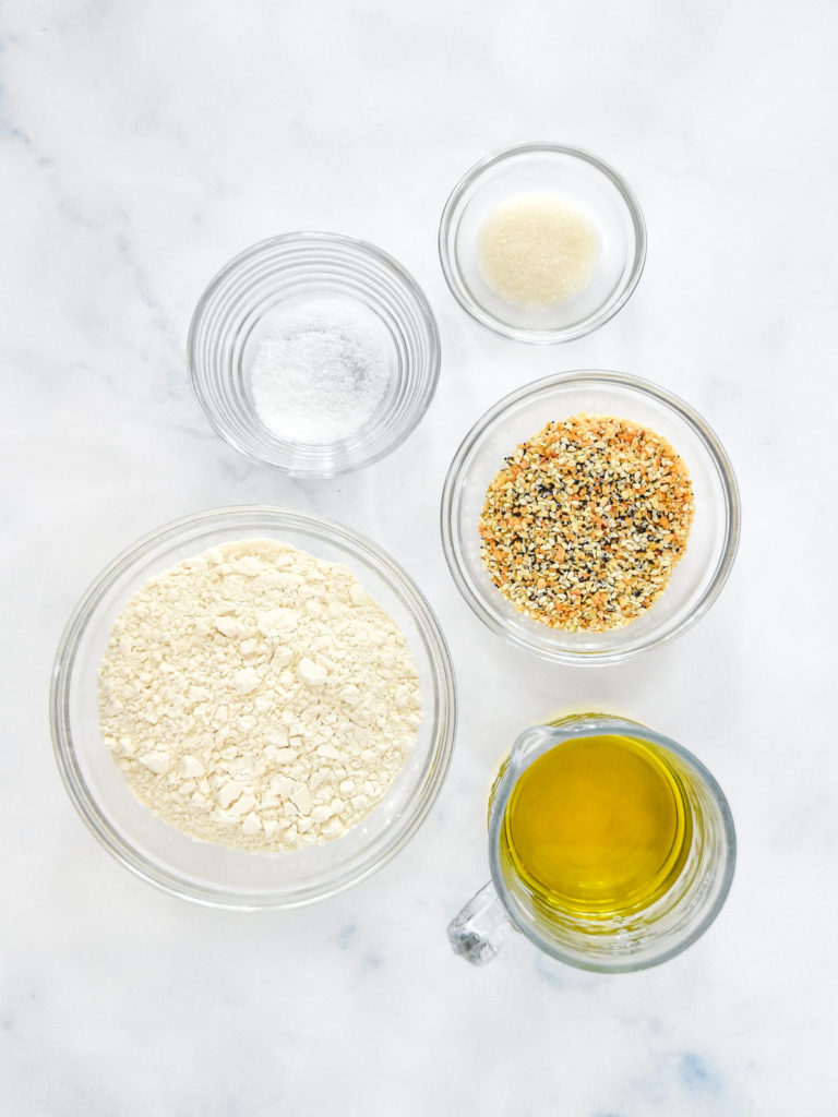 ingredients for the homemade everything but the bagel crackers in separate bowls.