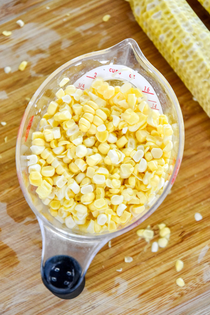 fresh corn kernels in a measuring cub.