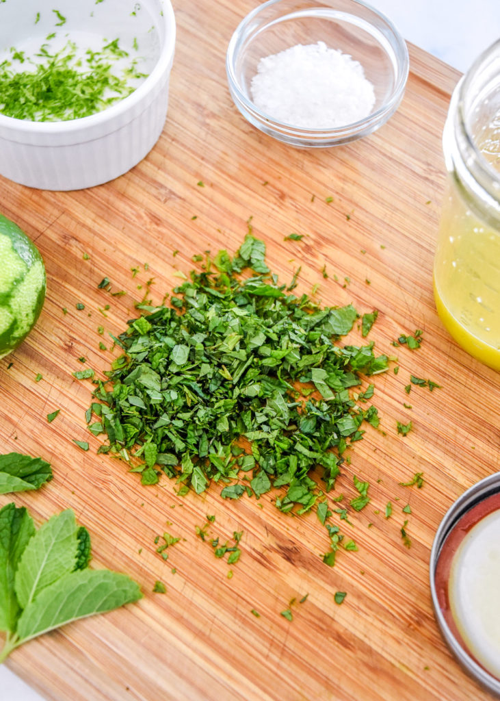 chopped mint on a cutting board.