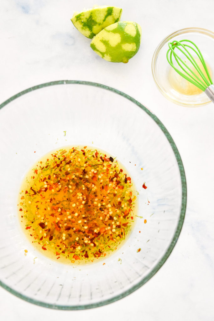 chili lime dressing in a glass mixing bowl.